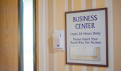 A sign posted on the wall reads Business Center Open 24 Hours Daily A sign posted on the wall reads Business Center Open 24 Hours Daily