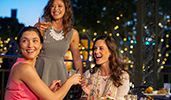 Three female Guests enjoy drinks and appetizers at an outdoor table
Three female Guests enjoy drinks and appetizers at an outdoor table