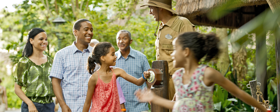 A family enjoys the ease of using MagicBands to get on Jungle Cruise attraction.